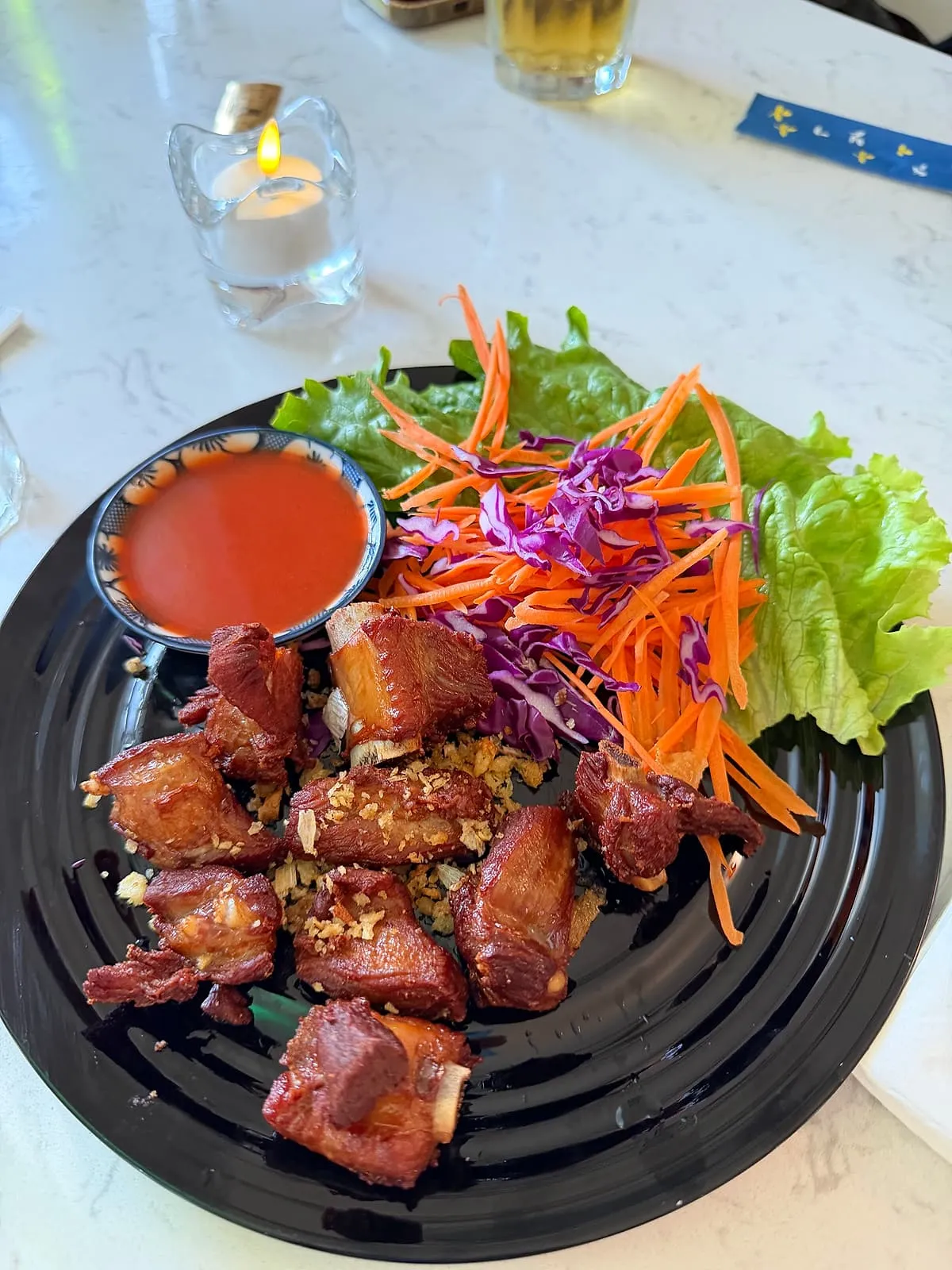 Crisp pork with shredded carrot, cabbage and a chili dipping sauce at Sno Thai Cafe Madison