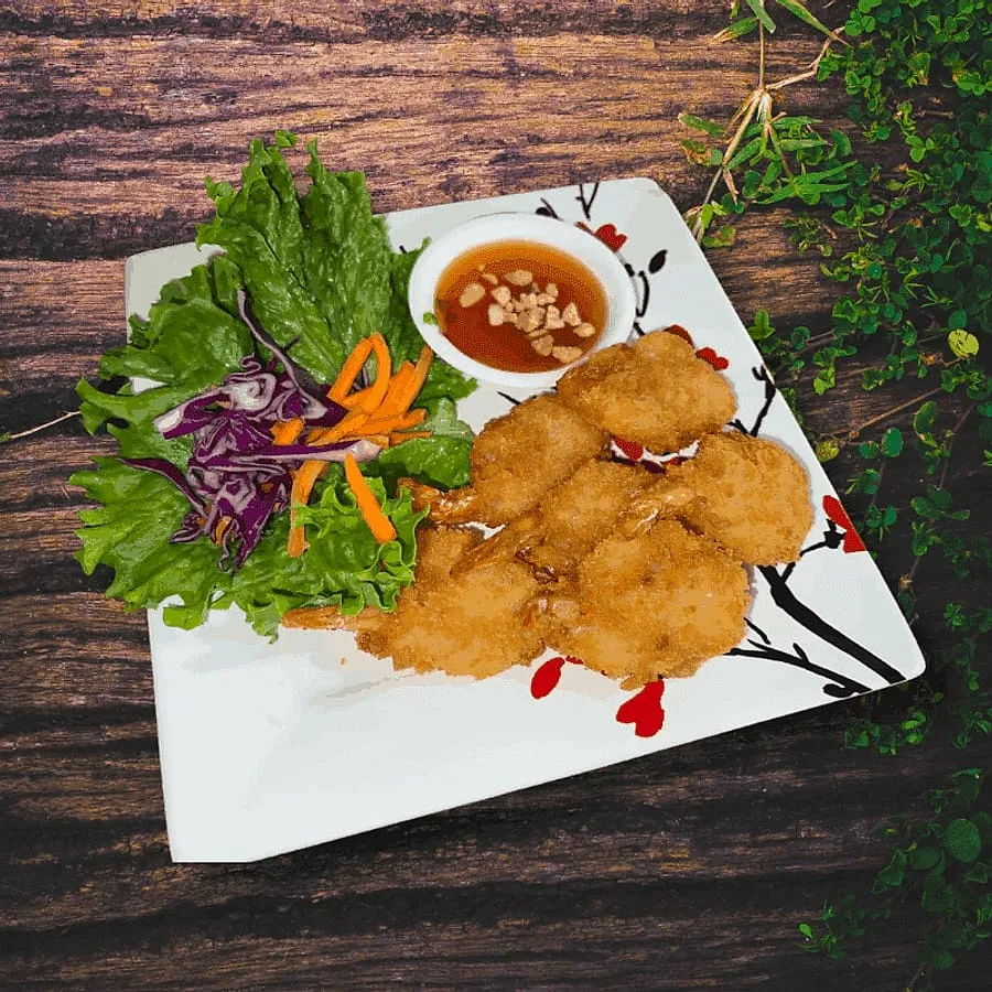 Fried shrimp with a sweet chili dipping sauce and salad at Sno Thai Cafe Madison, Seattle